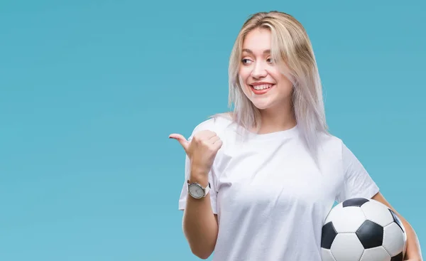 Young Blonde Woman Holding Soccer Football Ball Isolated Background Pointing — Stock Photo, Image