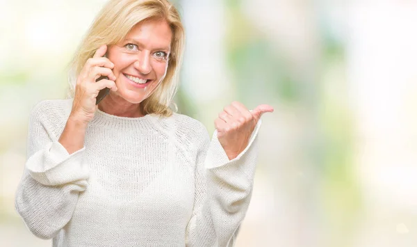 Middle Age Blonde Woman Talking Smartphone Isolated Background Pointing Showing — Stock Photo, Image