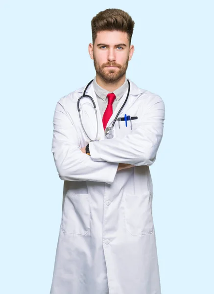 Young Handsome Doctor Man Wearing Medical Coat Skeptic Nervous Disapproving — Stock Photo, Image