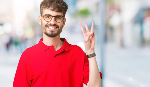 잘생긴 남자에 안경을 보여주는 손가락으로 가리키는 세번째 자신감과 — 스톡 사진