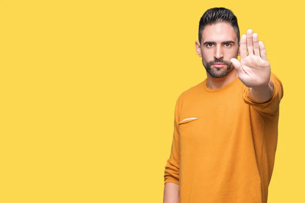 Stock image Young handsome man over isolated background doing stop sing with palm of the hand. Warning expression with negative and serious gesture on the face.