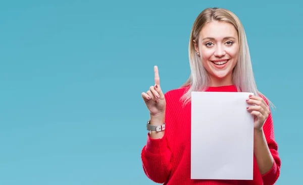 Young Blonde Woman Holding Blank Paper Sheet Isolated Background Surprised — Stock Photo, Image
