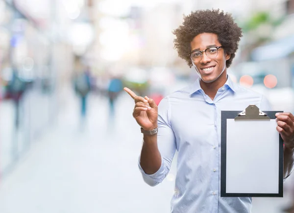 Afro American Man Holding Clipboard Isolated Background Very Happy Pointing — Stock Photo, Image