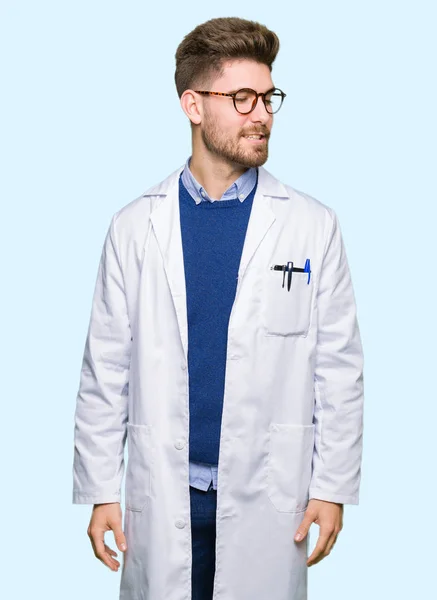 Young Handsome Scientist Man Wearing Glasses Looking Away Side Smile — Stock Photo, Image