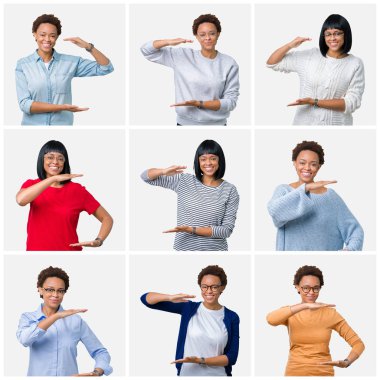 Büyük ve büyük boy işaret, ölçü birimi sembol gösteren ellerle eller izole arka plan üzerinde afro saçlı genç Afro-Amerikan kadın. Kameraya bakarak gülümsüyordu. Ölçüm kavramı.