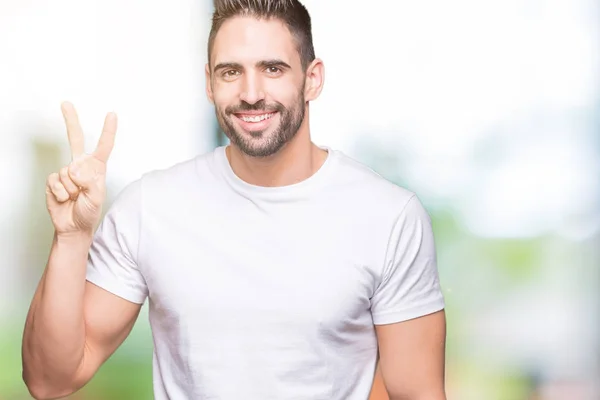 Joven Hombre Vistiendo Casual Camiseta Blanca Sobre Fondo Aislado Mostrando — Foto de Stock