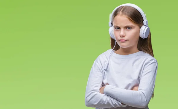 Giovane Bella Ragazza Con Cuffie Ascoltare Musica Sfondo Isolato Scettico — Foto Stock