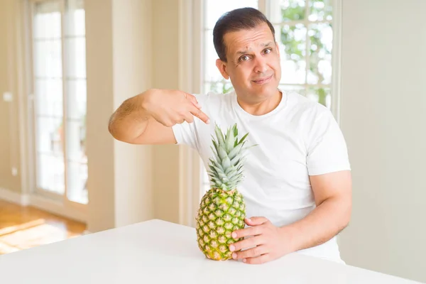 Middle Age Man Eating Fresh Tropical Pineapple Home Surprise Face — Stock Photo, Image