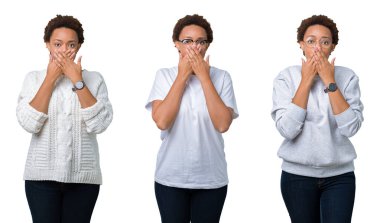 İzole arka plan ağız hata için elleriyle kapsayan şok üzerinde afro saçlı genç Afro-Amerikan kadın. Gizli kavramı.