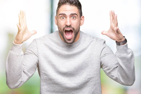 Joven Hombre Guapo Con Sudadera Sobre Fondo Aislado Celebrando Loco —  Fotos de Stock