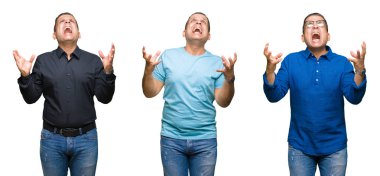 Arap orta yaş erkek izole arka plan çılgın ve kızgın bağırarak ve agresif ifade ve silah kaldırdı bağırmaya bileşimi. Hayal kırıklığı kavramı.