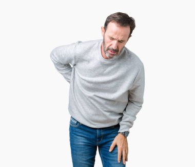 Bir kazak izole üzerinde giyen yakışıklı orta yaş üst düzey adam arka plan geri el ile kas ağrısı dokunmadan acı sırt ağrısı,