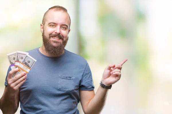 Junger Hipster Mann Mit Geldbündel Über Isoliertem Hintergrund Sehr Glücklich — Stockfoto