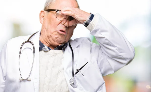 Handsome Senior Doctor Man Wearing Medical Coat Smelling Something Stinky — Stock Photo, Image