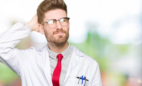 Young Handsome Scientist Man Wearing Glasses Confuse Wonder Question Uncertain — Stock Photo, Image