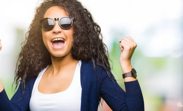 Young Beautiful Girl Curly Hair Wearing Fashion Sunglasses Celebrating Surprised — Stock Photo, Image