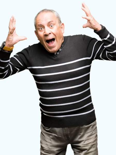 Handsome Senior Man Wearing Winter Stripes Sweater Celebrating Crazy Amazed — Stock Photo, Image