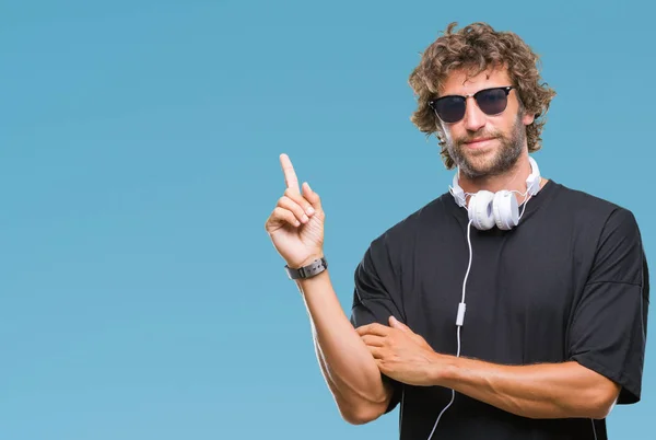 Handsome Hispanic Man Listening Music Wearing Headphones Isolated Background Big — Stock Photo, Image