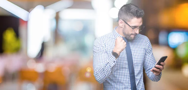 Young Business Man Using Smartphone Isolated Background Screaming Proud Celebrating — Stock Photo, Image