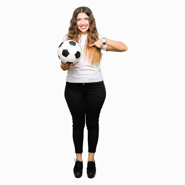 Young Adult Woman Holding Soccer Football Ball Surprise Face Pointing — Stock Photo, Image