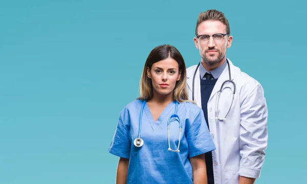 Young Couple Doctor Surgeon Isolated Background Serious Expression Face Simple — Stock Photo, Image