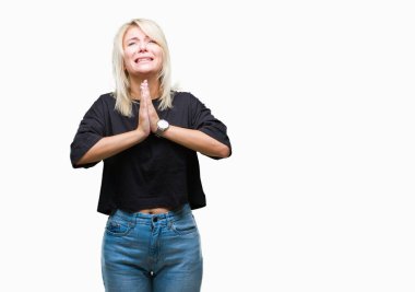 Genç güzel sarışın kadın dilencilik ve umut ifade yüzünde çok duygusal ve endişe ile birlikte elleriyle dua izole arka plan yüzünden. Bağışlanmak. Din kavramı.