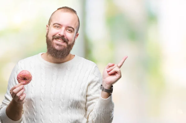 Jeune Homme Hipster Caucasien Mangeant Beignet Sucré Sur Fond Isolé — Photo