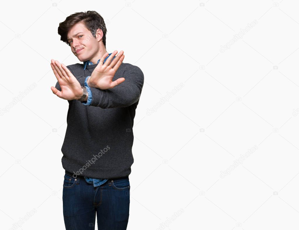 Young handsome elegant man over isolated background Rejection expression crossing arms and palms doing negative sign, angry face