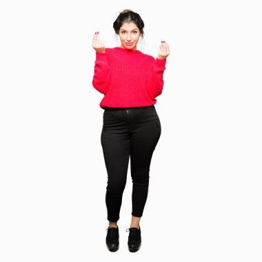 Maaş ödeme için milyoner iş soran kırmızı kazak ve çörek yapıyor para hareketi el ile giyen genç güzel kadın