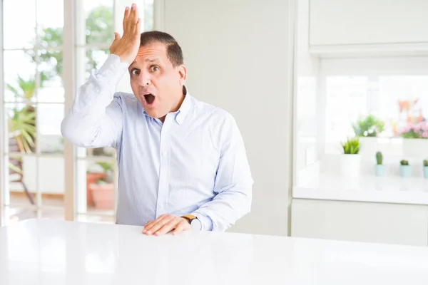 Middle Age Man Sitting Home Surprised Hand Head Mistake Remember — Stock Photo, Image