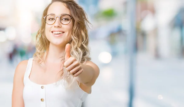 Beautiful Young Blonde Woman Wearing Glasses Blurred Background Doing Happy — Stock Photo, Image