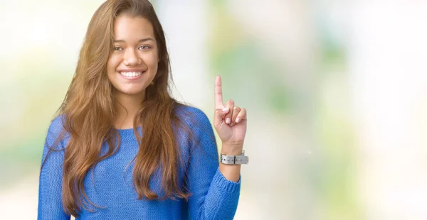 Ung Vacker Brunett Kvinna Klädd Blå Tröja Över Isolerade Bakgrund — Stockfoto