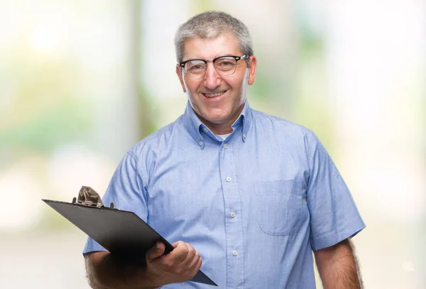 Handsome Senior Inspector Man Holding Clipboard Isolated Background Happy Face — Stock Photo, Image