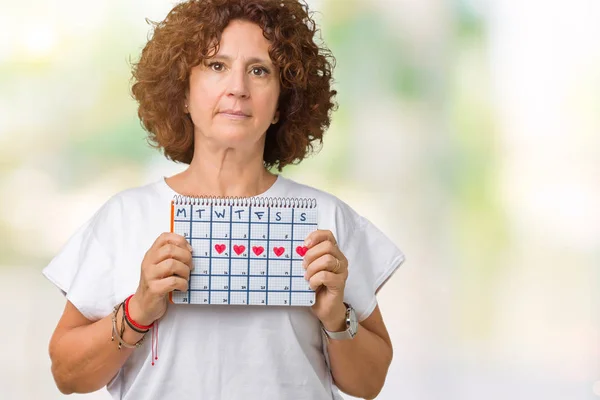 Médio Ager Mulher Sênior Segurando Calendário Menstruação Sobre Fundo Isolado — Fotografia de Stock