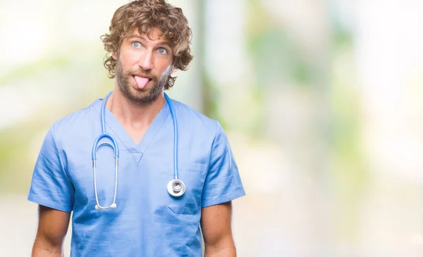 Handsome Hispanic Surgeon Doctor Man Isolated Background Sticking Tongue Out — Stock Photo, Image