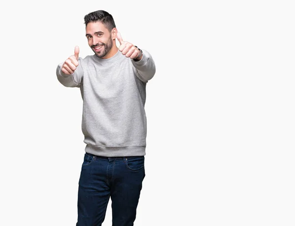 Joven Hombre Guapo Con Sudadera Sobre Fondo Aislado Aprobando Hacer — Foto de Stock