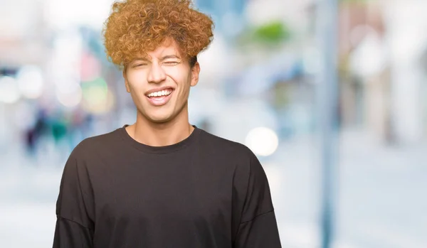 Young Handsome Man Afro Hair Wearing Black Shirt Winking Looking — Stock Photo, Image