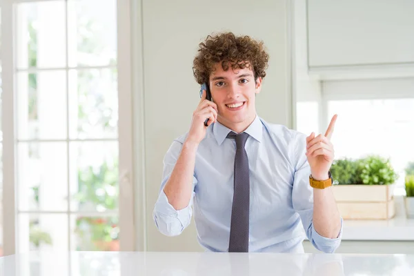 Young Business Man Talking Smartphone Office Very Happy Pointing Hand — Stock Photo, Image