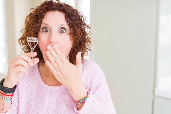 Senior Woman Using Eyelashes Curler Mascara Cover Mouth Hand Shocked — Stock Photo, Image