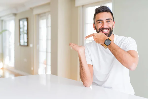 Handsome Hispanic Man Casual White Shirt Home Amazed Smiling Camera — Stock Photo, Image