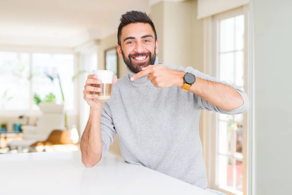 Handsome Hispanic Man Drinking Cup Coffee Very Happy Pointing Hand — Stock Photo, Image