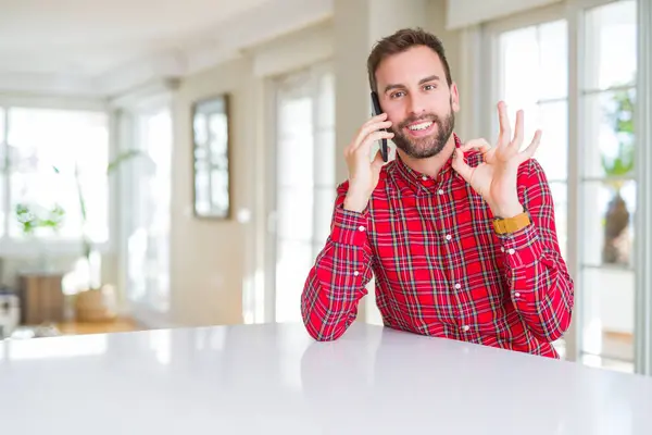 Handsome Man Talking Smartphone Doing Sign Fingers Excellent Symbol — Stock Photo, Image