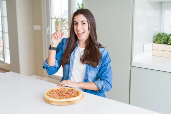 Beautiful Young Woman Eating Homemade Tasty Pizza Kitchen Pointing Finger — Stock Photo, Image