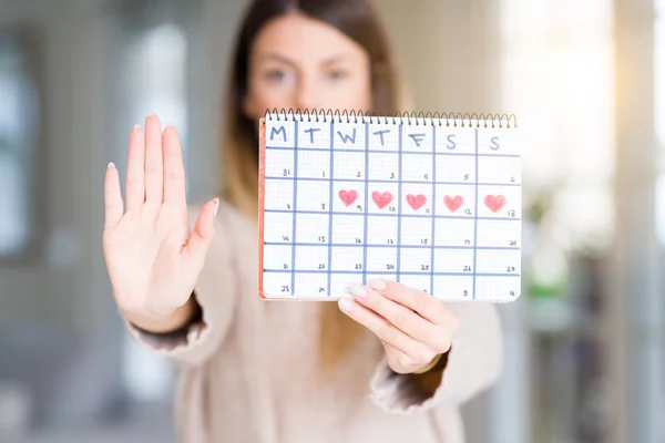 Young Beautiful Woman Holding Menstruation Calendar Home Open Hand Doing — Stock Photo, Image