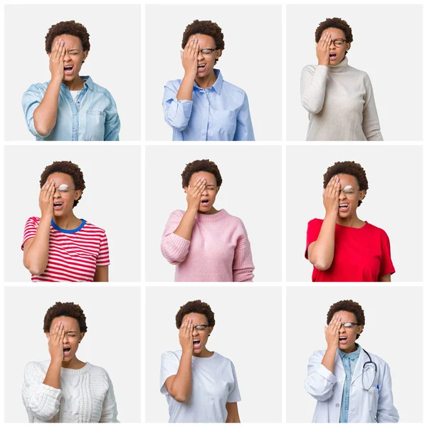 Yarım yüz, göz ve ağız el ile kapsayan yorgun esneme izole arka plan üzerinde afro saçlı genç Afro-Amerikan kadın. Acı yüzü acıyor.