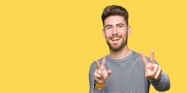 Young Handsome Man Wearing Stripes Sweater Smiling Looking Camera Showing — Stock Photo, Image