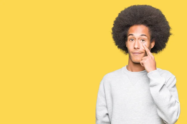 Young African American Man Afro Hair Wearing Sporty Sweatshirt Pointing — Stock Photo, Image