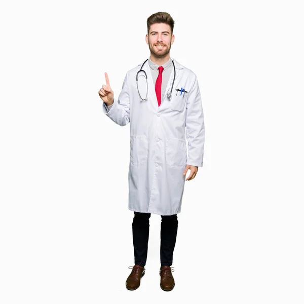 Young Handsome Doctor Man Wearing Medical Coat Showing Pointing Finger — Stock Photo, Image