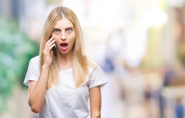 Young Beautiful Blonde Woman Talking Using Smartphone Isolated Background Scared — Stock Photo, Image