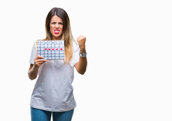 Mooie Jongedame Holding Menstruatie Kalender Geïsoleerde Achtergrond Boos Gefrustreerd Schreeuwen — Stockfoto
